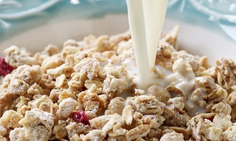 Milk pouring into cereal