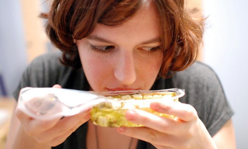 Woman smelling food